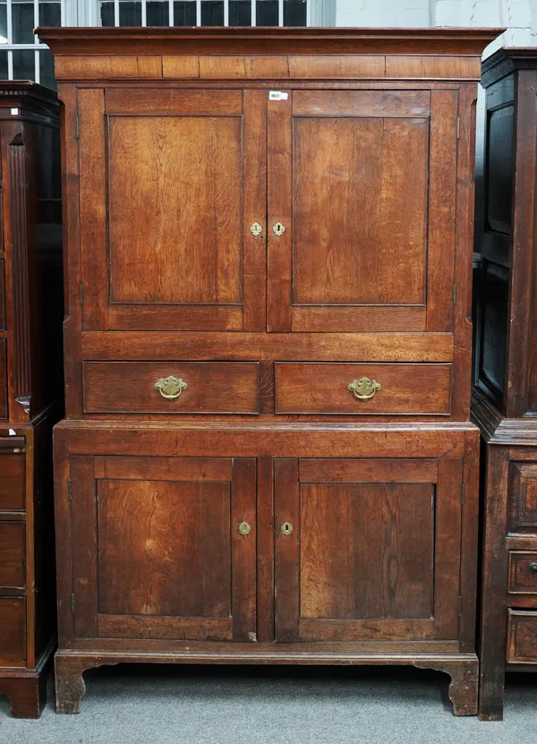 AN 18TH CENTURY OAK DOUBLE HEIGHT TWO DOOR HOUSEKEEPER’S CUPBOARD