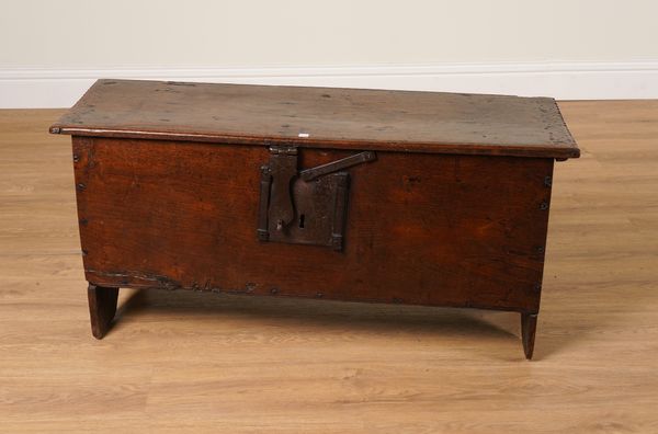 A 17TH CENTURY OAK PLANK COFFER WITH CHIP CARVED DECORATION