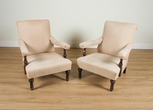 A PAIR OF LATE 19TH CENTURY MAHOGANY FRAMED OPEN ARM EASY CHAIRS (2)