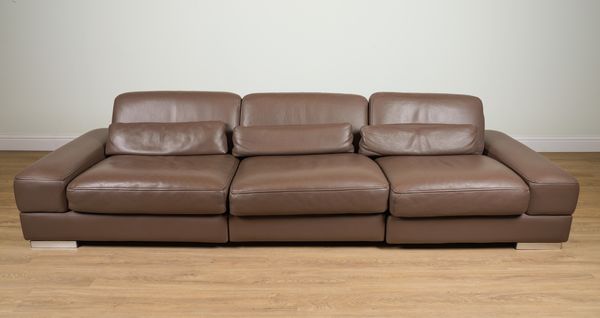 ROCHE BOBOIS; A BROWN LEATHER UPHOLSTERED TRIPLE SECTION SOFA