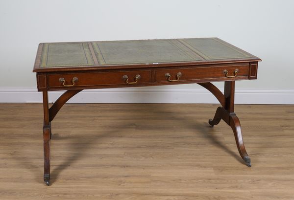 A REGENCY STYLE MAHOGANY TWO DRAWER WRITING DESK