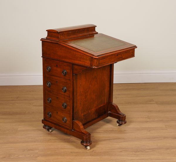 A VICTORIAN INLAID FIGURED WALNUT DAVENPORT WITH FOUR SIDE DRAWERS