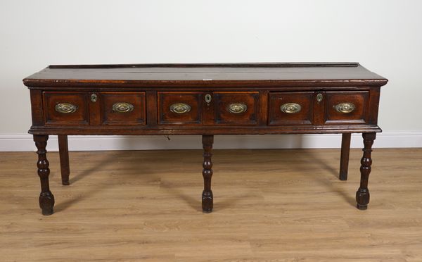 A LATE 17TH CENTURY JAMES II THREE DRAWER OAK DRESSER BASE ON TURNED SUPPORTS WITH LATER PARTS