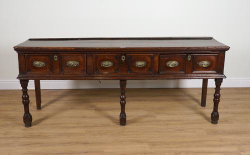 A LATE 17TH CENTURY JAMES II THREE DRAWER OAK DRESSER BASE ON TURNED SUPPORTS WITH LATER PARTS