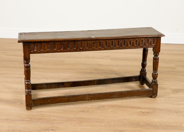 A 17TH CENTURY AND LATER LONG OAK JOINT STOOL