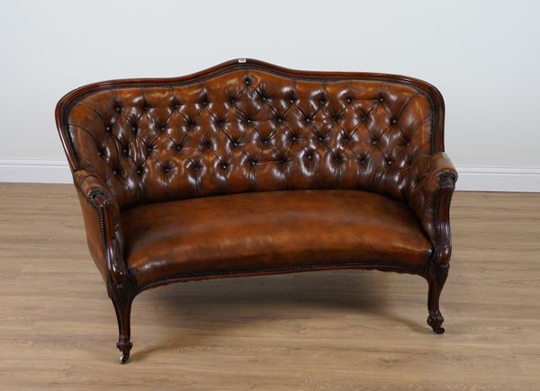 A 19TH CENTURY TAN LEATHER UPHOLSTERED ROSEWOOD FRAMED DOUBLE SPOON BACK SOFA