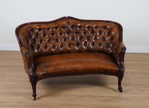 A 19TH CENTURY TAN LEATHER UPHOLSTERED ROSEWOOD FRAMED DOUBLE SPOON BACK SOFA
