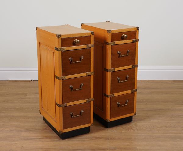 A PAIR OF BRASS BOUND CAMPAIGN STYLE  FOUR DRAWER BEDSIDE TABLES (2)