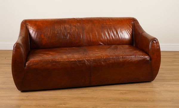 IN THE MANNER OF HEALS; A TAN LEATHER UPHOLSTERED THREE SEAT SOFA