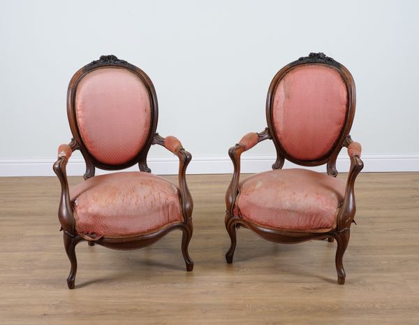 A PAIR OF 19TH CENTURY FRENCH CARVED ROSEWOOD FRAMED SPOON BACK OPEN ARMCHAIRS (2)