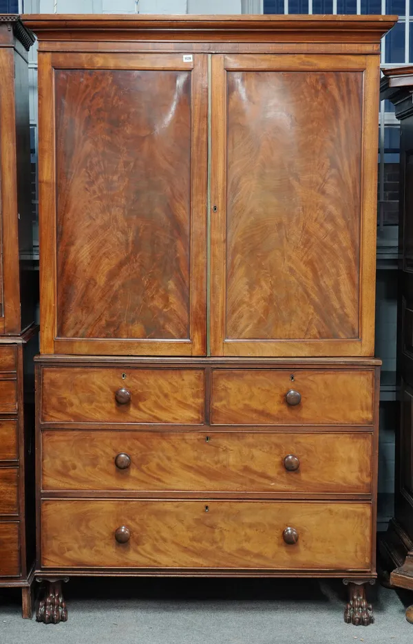 A LATE GEORGE III MAHOGANY LINEN PRESS