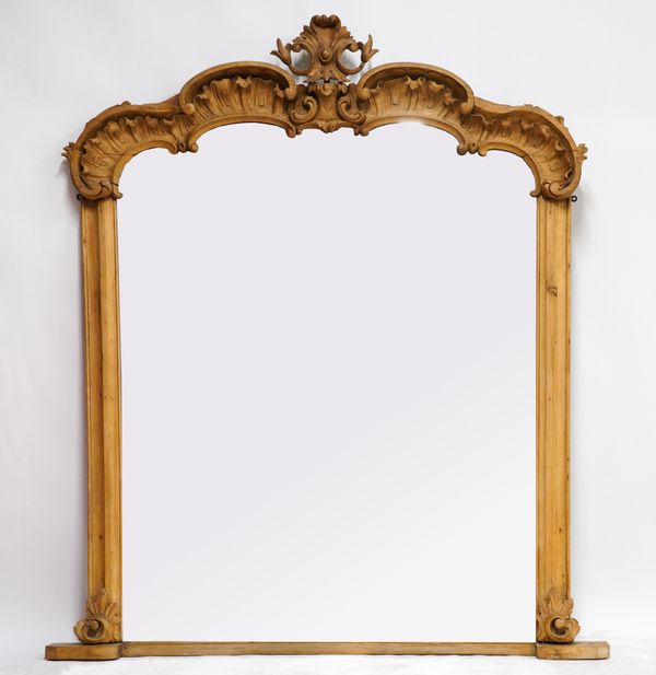 A 19TH CENTURY CARVED PINE SHAPED ARCH TOP OVERMANTEL MIRROR