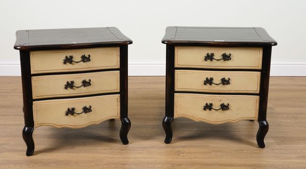 A PAIR OF FRENCH STYLE EBONISED AND CREAM PAINTED THREE DRAWER BEDSIDE TABLES (2)