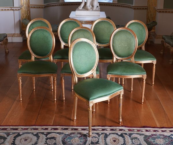A SET OF EIGHT LOUIS XVI STYLE GILT FRAMED DINING CHAIRS (8)