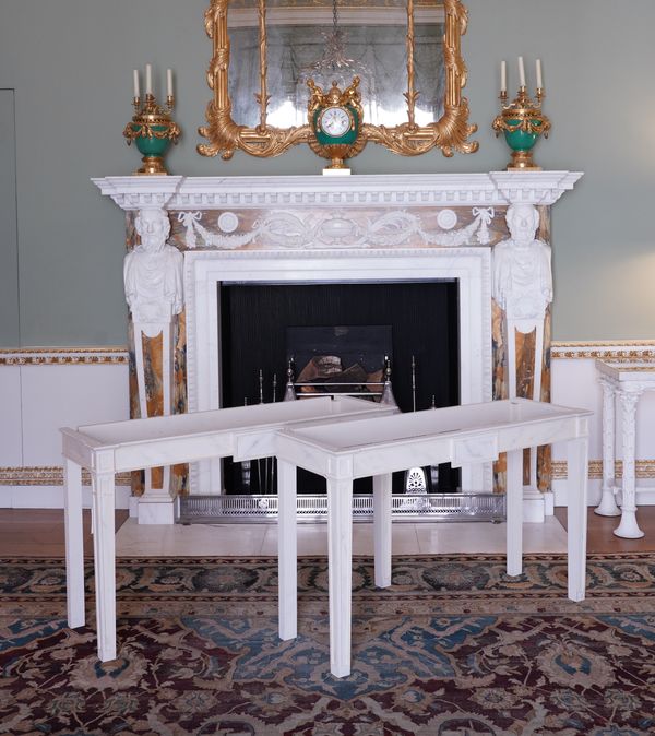 DONAL CHANNER AND CO AFTER A DESIGN BY JOHN YENN; A PAIR OF FAUX MARBLE PAINTED CONSOLE TABLE BASES