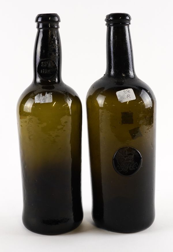 TWO `BLACK GLASS' SEALED WINE BOTTLES (2)