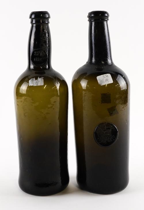 TWO `BLACK GLASS' SEALED WINE BOTTLES (2)