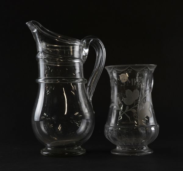 AN ENGRAVED GLASS TANKARD