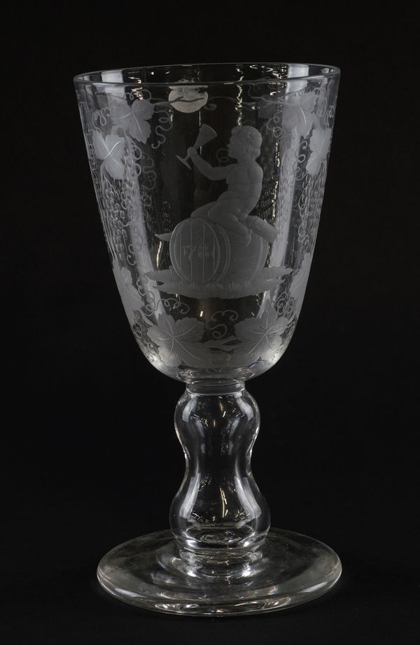 A LARGE ENGRAVED GLASS GOBLET