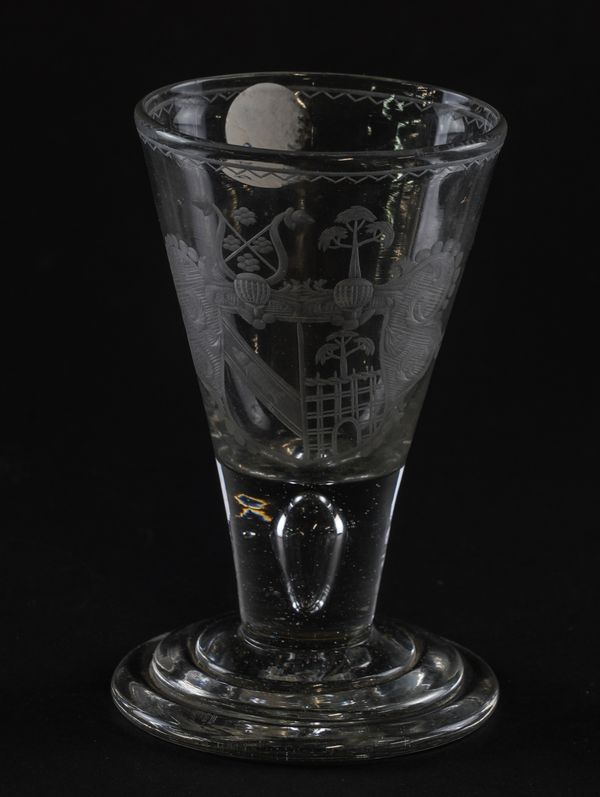 AN ENGRAVED ARMORIAL DRAM OR FIRING GLASS