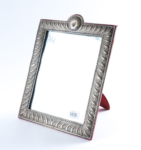 A LATE VICTORIAN SILVER MOUNTED MIRROR