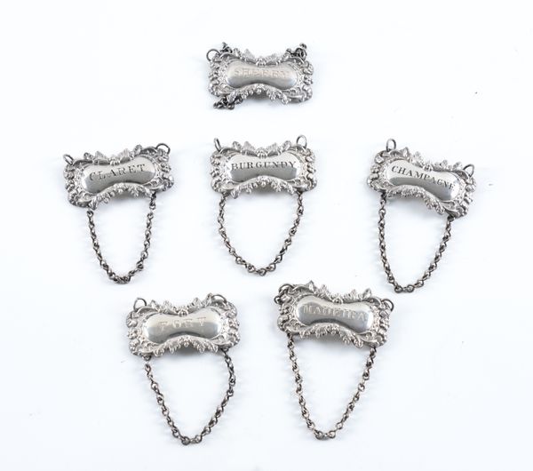 A SET OF SIX VICTORIAN SILVER DECANTER LABELS (6)