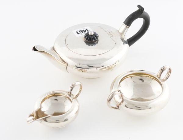 A SILVER THREE PIECE TEA SET