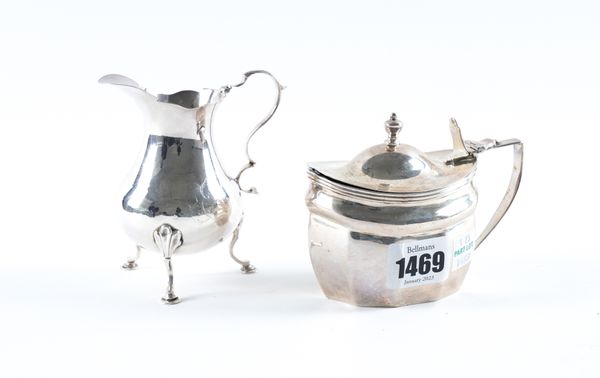 A SILVER MUSTARD POT AND A SILVER CREAM JUG (2)