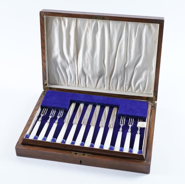 A SET OF TWELVE PAIRS OF SILVER AND MOTHER-OF-PEARL DESSERT OR FRUIT KNIVES AND FORKS