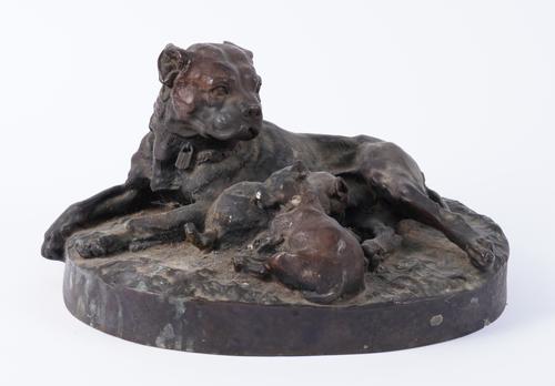 A BRONZE RESIN GROUP OF A DOG AND TWO PUPPIES