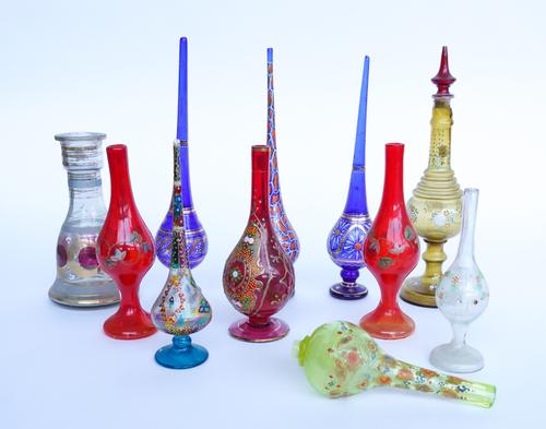 A GROUP OF BOHEMIAN GLASS ENAMEL DECORATED ROSEWATER SPRINKLERS, SPILL VASES AND BASES (11)