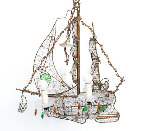 A GILT-METAL AND GLASS MOUNTED FOUR LIGHT SHIP-SHAPED CHANDELIER