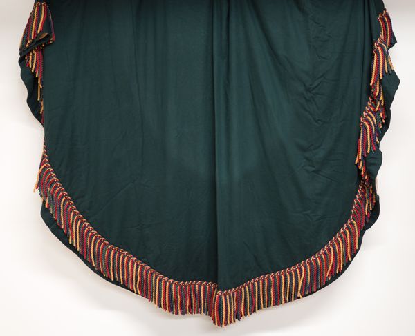 DESIGNED BY DAVID MLINARIC LTD: A DARK GREEN BAIZE TABLE COVER WITH CORD FRINGE (2)
