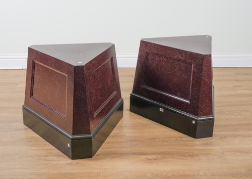 A PAIR OF SIMULATED PORPHYRY TRIANGULAR PEDESTALS (2)