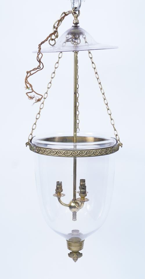 FOUR REGENCY STYLE GILT-BRASS MOUNTED GLASS FOUR LIGHT PENDANTS WITH SMOKE CANOPIES (7)