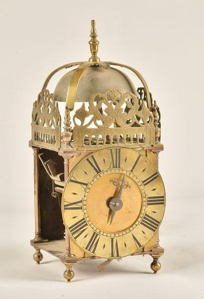 A BRASS STRIKING LANTERN CLOCK