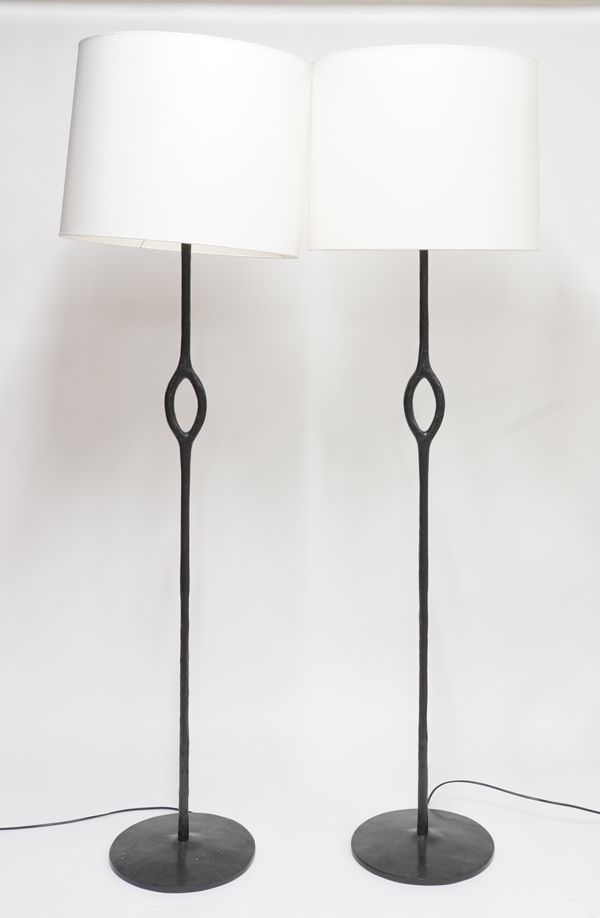 CHRISTIAN LIAIGRE (FRENCH 1943-2020); A PAIR OF BLACK PATINATED CAST-BRONZE ‘AMANDE’ FLOOR STANDING LAMPS (2)