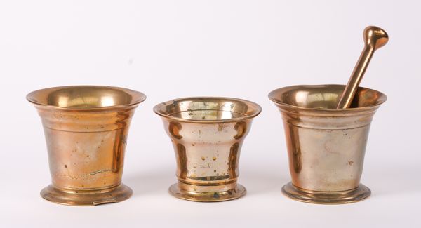 A GROUP OF THREE POLISHED BRONZE MORTARS (4)