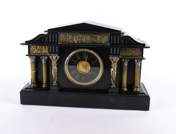 A FRENCH GILT-METAL MOUNTED BLACK MARBLE MANTEL CLOCK