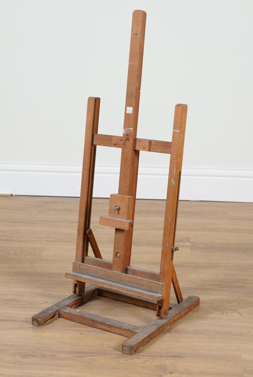 A 20TH CENTURY BEECH ANGLE AND HEIGHT ADJUSTABLE TABLETOP ARTIST’S H-FRAMED EASEL