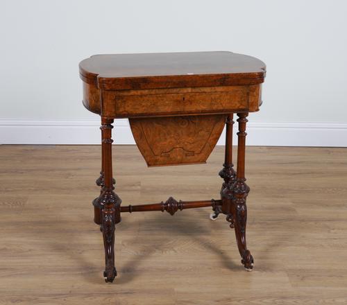 A VICTORIAN INLAID FIGURED WALNUT GAMES/WORK TABLE