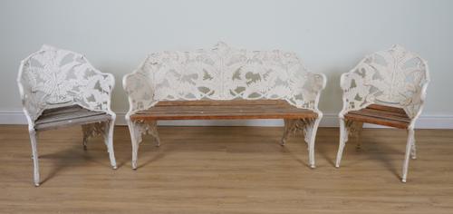 AFTER COALBROOKDALE; A SUITE OF WHITE PAINTED ALUMINIUM FERN AND BERRY PATTERN GARDEN FURNITURE  (3)
