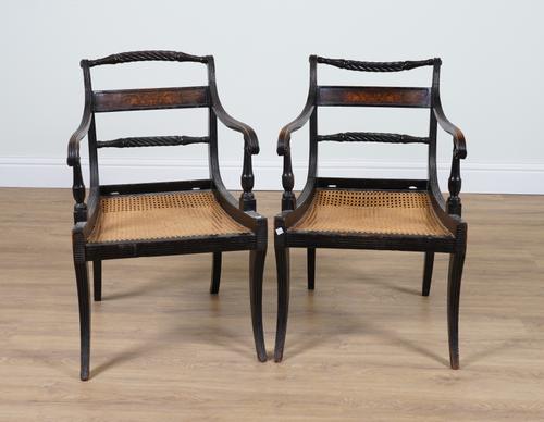 A PAIR OF REGENCY EBONISED BEECH SABRE LEGGED OPEN ARMCHAIRS  (2)