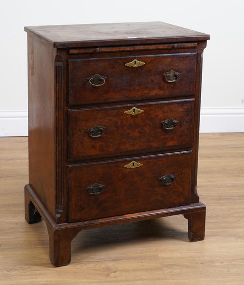 A GEORGE II STYLE 19TH CENTURY FIGURED WALNUT THREE DRAWER CHEST