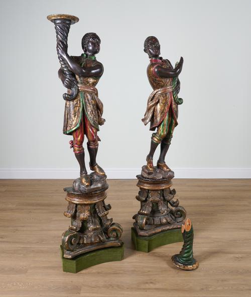 A PAIR OF POLYCHROME PAINTED FIGURES OF MOORS (2)