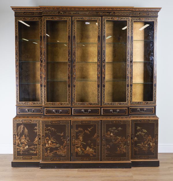 AN EARLY 20TH CENTURY BLACK LACQUER CHINOISERIE DECORATED BREAKFRONT BOOKCASE CABINET