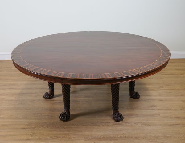 A LARGE REGENCY STYLE COROMANDEL BANDED MAHOGANY CIRCULAR CENTRE TABLE