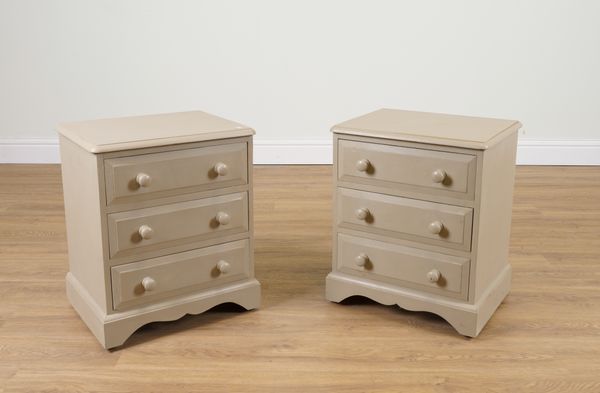 A PAIR OF GREY PAINTED PINE THREE DRAWER BEDSIDE TABLES (2)