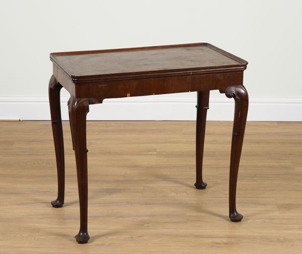 A GEORGE III RECTANGULAR MAHOGANY PAD FOOT SILVER TABLE