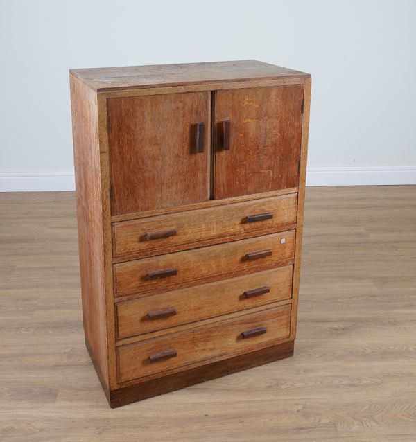 POSSIBLY HEALS; A MID-20TH CENTURY OAK SMALL LINEN PRESS